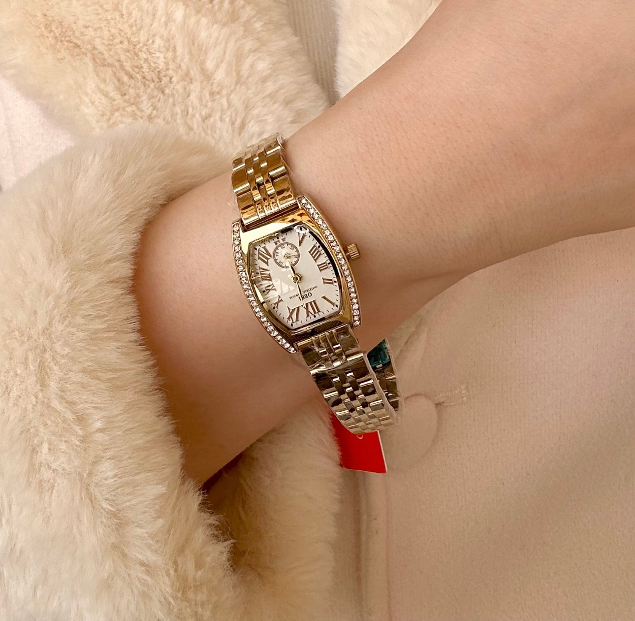 Gold and white zircon ibso watch