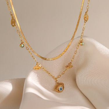 Layered evil & snake necklace