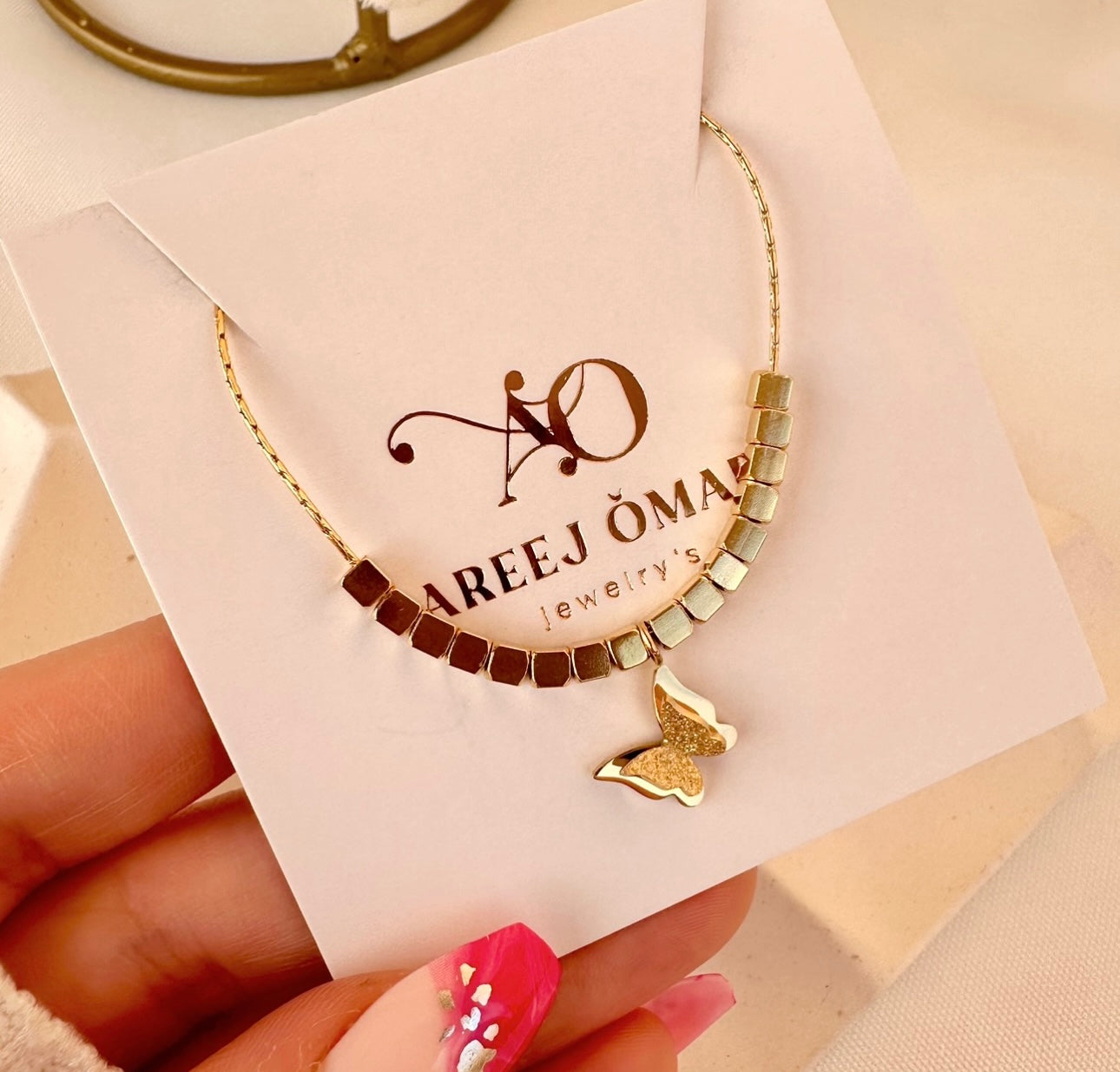 Butterfly ball necklace